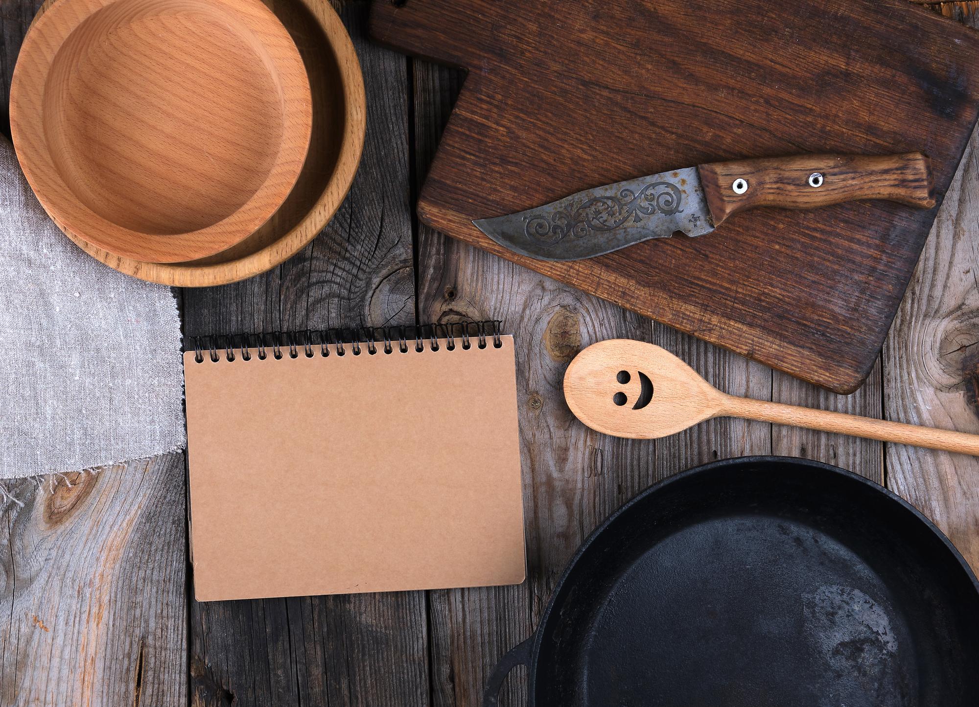 A flat lay of recipe cards and measuring spoons